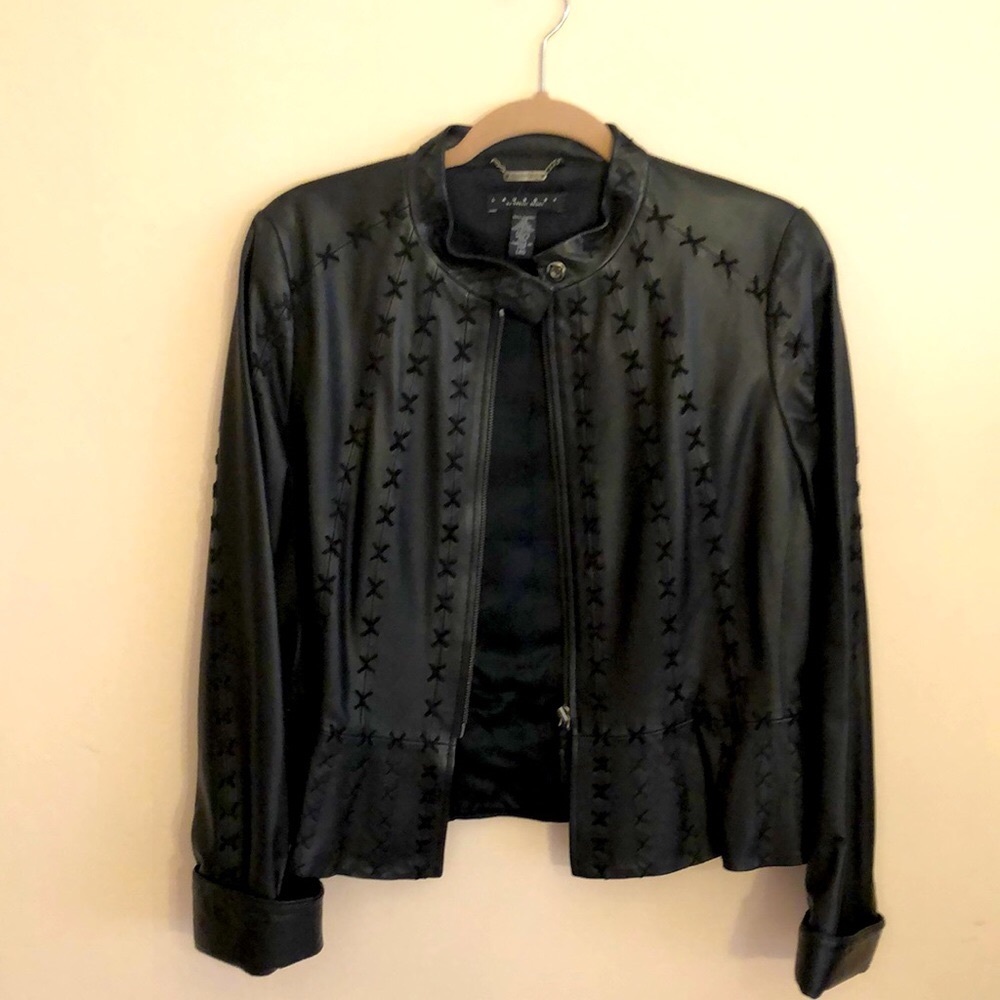 100% soft natural leather with  design in front. in excellent condition